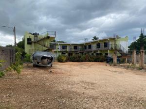 a building with a cow statue in front of it at Hotel centro de Pedernales in Pedernales