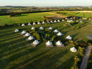 an overhead view of a group of tents in a field at Glamping pospolu in Mokrovraty +38 photos