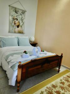 a bedroom with a bed with towels on it at Quiet Mountain View Retreat Helicon, Kyriaki in Kiriákion
