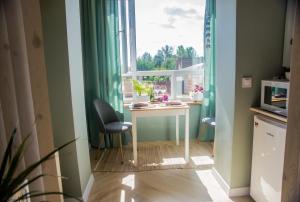 a small room with a table and a window at Kolo in Boryspil