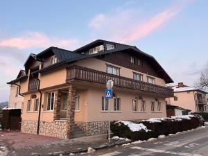 a large house on the side of a street at Hotel Four Seasons in Samokov
