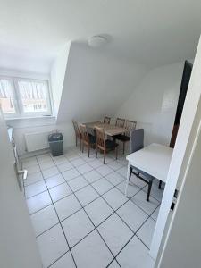 a dining room with a table and chairs at AlWi Apartment Wohnung 3 in Moringen