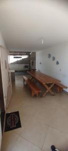 a large room with a wooden table in it at Casa de praia castelhanos in Anchieta