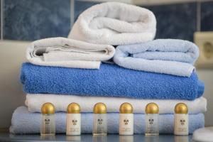 a pile of towels sitting on top of a table at Wildwiesenhof in Miesenbach +31 photos