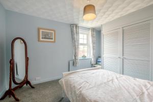 a bedroom with a bed and a window at 2 Bed in Heacham oc-p29546 in Heacham