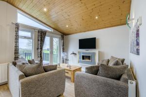 a living room with two couches and a tv at Field View 1 bed-No Pets- Walnut in Eye