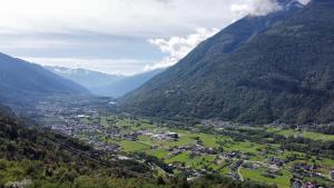 an aerial view of a valley in the mountains at Foresteria Emilia in Grosotto