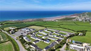 an aerial view of a resort next to the ocean at Widemouth Waves Holiday Chalet in Poundstock