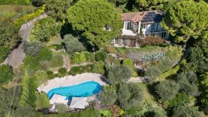 an aerial view of a house with a swimming pool at Villa Rosa del Garda Golf and Bike in Garda +42 photos