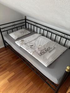 a metal bed with a blanket on top of it at Ferienwohnung Dallinger in Radmer an der Stube