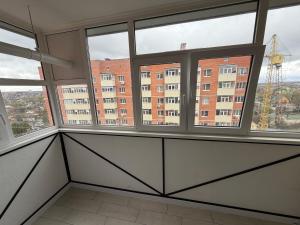 an empty room with windows in a building at 2 кім кв BIG APARTMENT TOP Center in Sumy