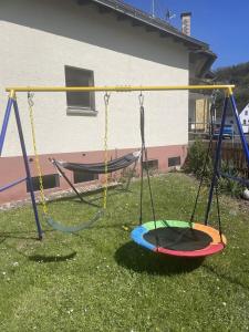 an empty swing set in a yard at Ferienwohnung Maria in Wimbach