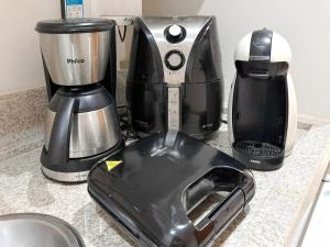 a kitchen counter with a blender and a toaster at STAY Cosmopolitan in Palmas +27 photos