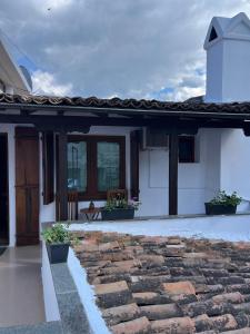 a house with a stone walkway in front of it at Hotel Berati in Berat
