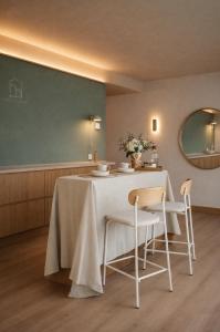 a dining room with a table and chairs at Pension Nagusia in Basauri