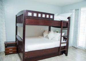 a couple of bunk beds in a room at Grato Pacho in Kisumu