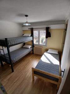 a room with two bunk beds and a window at Casa central hostel in San Carlos de Bariloche