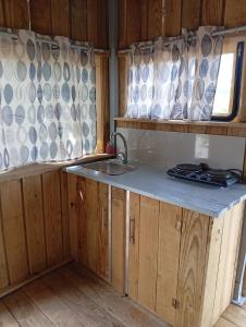 a kitchen with a sink and a counter top at Cabana do Gipsy in Ponte da Barca +24 photos