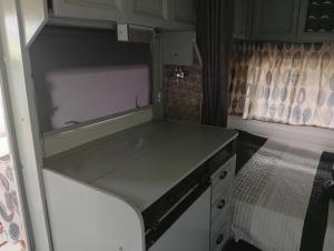an empty kitchen with a counter in an rv at Cabana do Gipsy in Ponte da Barca