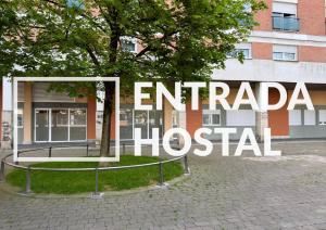 a sign that reads embassy hospital in front of a building at Pension Nagusia in Basauri