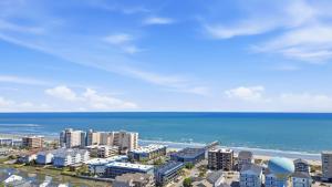 an aerial view of a beach with buildings and the ocean at Tide Time Oceanfront at Sea Cabin w Pool in Myrtle Beach