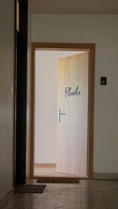 a large white door with the words rancher on it at Apartment Planika Bovec in Bovec