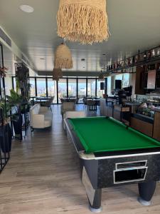 a bar with a pool table in a room at CoveDream Studio Cove Garden Sun Valley Esentepe in Aglantzia