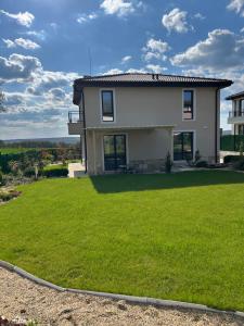 a house with a large lawn in front of it at Villa Belvedere in Varna City