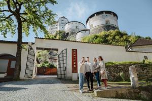 a group of people standing in front of a building at Aparthotel Viktorias Home in Kufstein