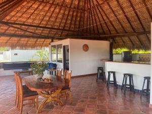 a dining room with a table and chairs at Penthouse Bella Vista in Puerto Escondido