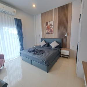 a bedroom with a blue bed in a room at Chao Pao Villa Phase 2 in Ko Phangan +9 photos