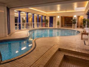 a large swimming pool in a hotel lobby at Craven Suite in Scarborough