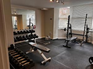 a gym with lots of equipment in a room at Craven Suite in Scarborough
