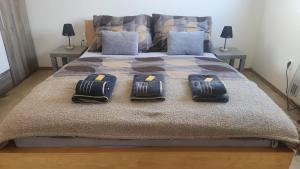 a bedroom with a bed with two pillows on it at Olšany Home - útulný privátní domek se zahradou a parkováním u Olomouce - private house with garden and parking near Olomouc in Olšany