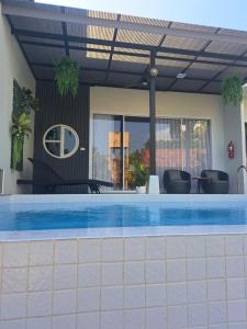 a swimming pool in a house with a roof at Chao Pao Villa Phase 2 in Ko Phangan