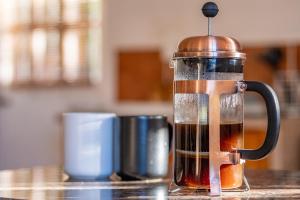 a coffee maker sitting on top of a counter at Olive's Cottage in Molteno +10 photos