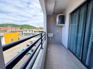 a balcony with a view of a city at Centro - flat completo para 4 pessoas in Brusque