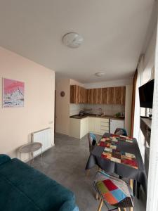 a living room with a couch and a table at Bakuriani apartment in Bakuriani