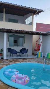 a large swimming pool in front of a house at Bela Casa PX as praias in São Luís