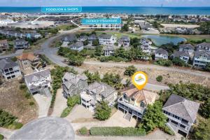 an aerial view of a residential neighborhood with houses at 6155 - Designed to Please in Nags Head