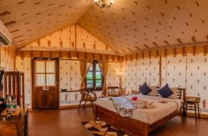 a bedroom with a large bed in a room at Desert Story Night Camp in Jaisalmer +49 photos