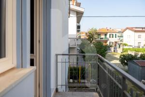 a balcony with a view of a city at Homiday - Appartamento Via Roma, 32 in Pineto