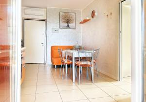 a dining room with a table and chairs at Holihome Hill View in Tortoreto Lido