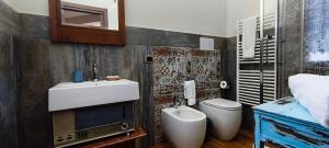 a bathroom with a sink and a toilet at B&B Della Via Francigena in Agrigento +50 photos