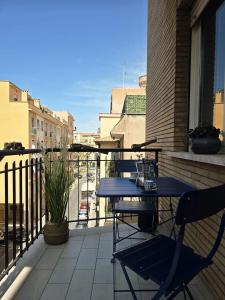 a blue table and chairs on a balcony at Townhouse 41 - by Be Your Home in Civitavecchia