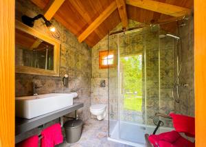 a bathroom with a sink and a shower at Park am See in Obertraun