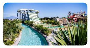 a water amusement park with a roller coaster at Studio du Mas du Jas in Bédarrides