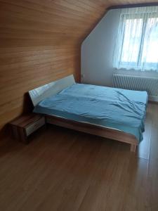 a small bedroom with a bed and a window at Haus Jörgbauerngut in Spielberg