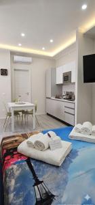 a room with two mattresses on the floor in a kitchen at Habibi Gerard in Torre del Greco +15 photos