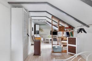 a room with a staircase and a living room at Fewo Kurt in Villingen-Schweninngen in Villingen-Schwenningen